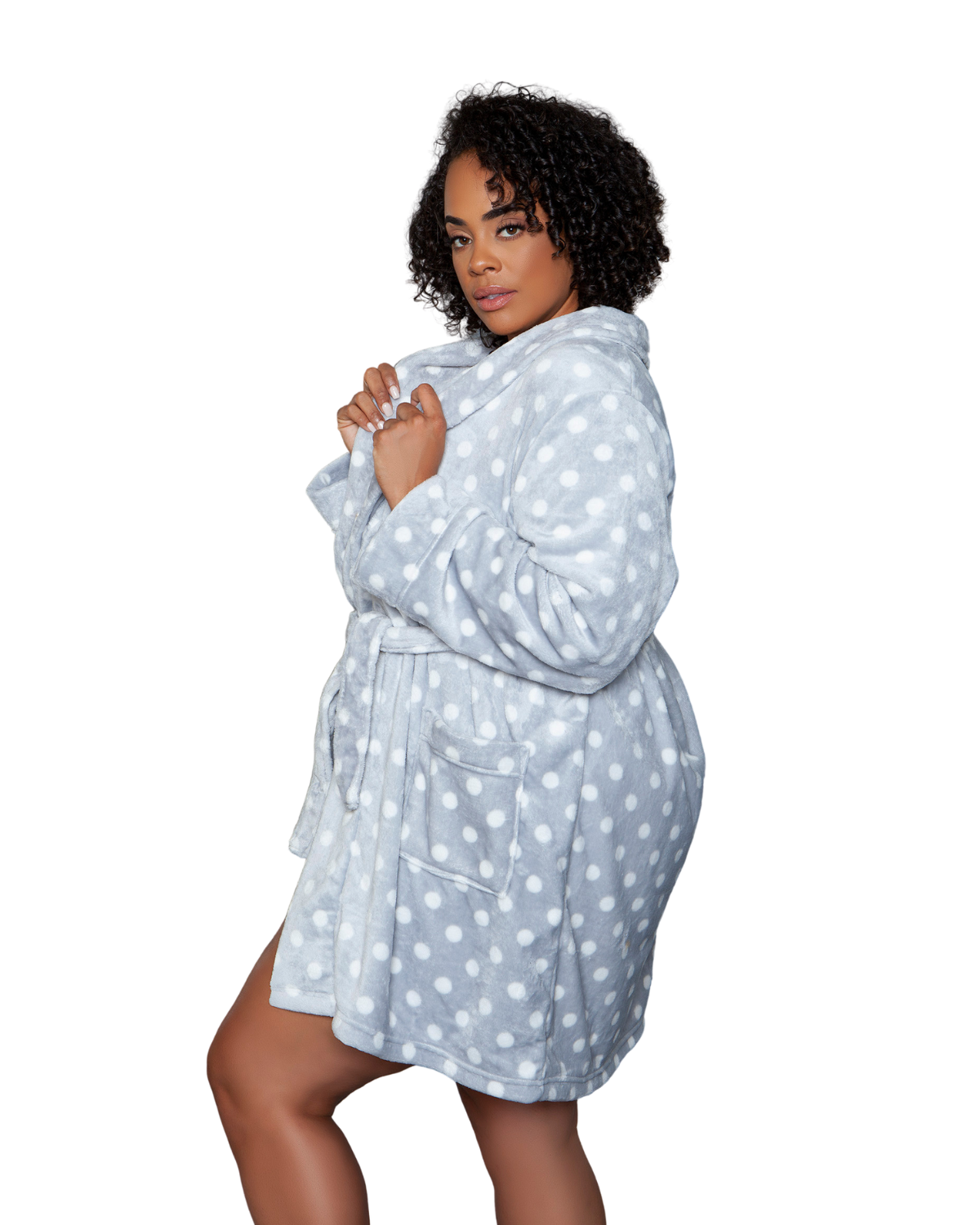 Model wearing a knee length plush robe in grey with white polka dots