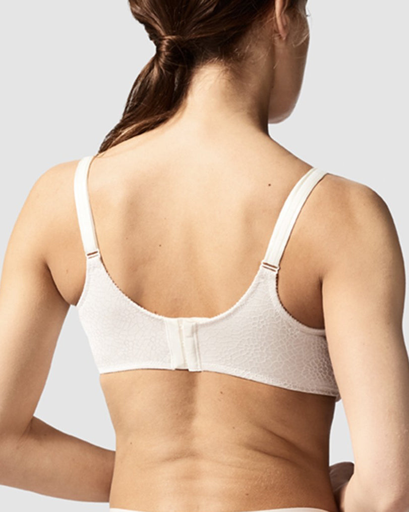 Model wearing a soft cup underwire bra in ivory