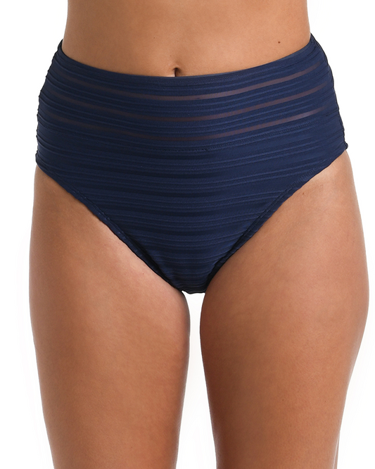 Model wearing a high waist bottom  in an indigo and mesh ottoman stripe design