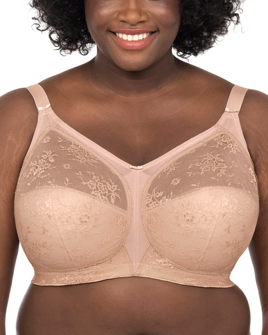 Model wearing a cut and sew banded wire free bra in nude