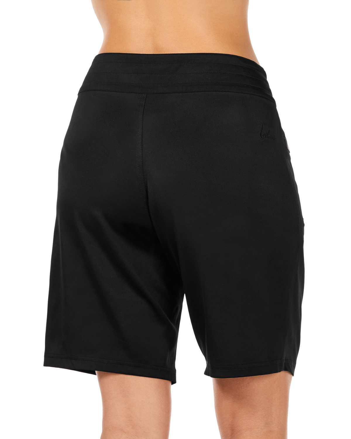 Model wearing a knee length board short in black