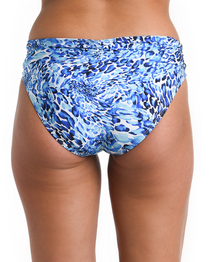 Model wearing a shirred hipster bottom in a blue and white aquatic print