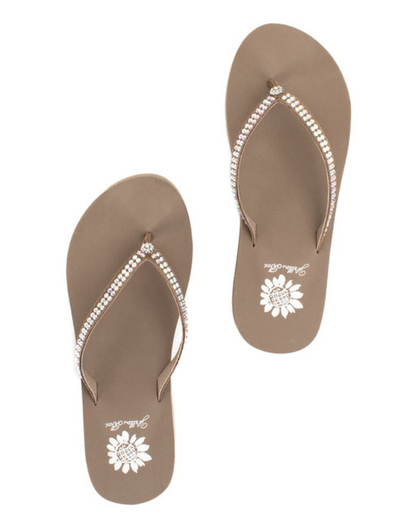 Top view of a pair of taupe wedge sandals with rhinestones on the strap on a white backdrop. The sandal has 1.75" heel height and 0.75" platform height.