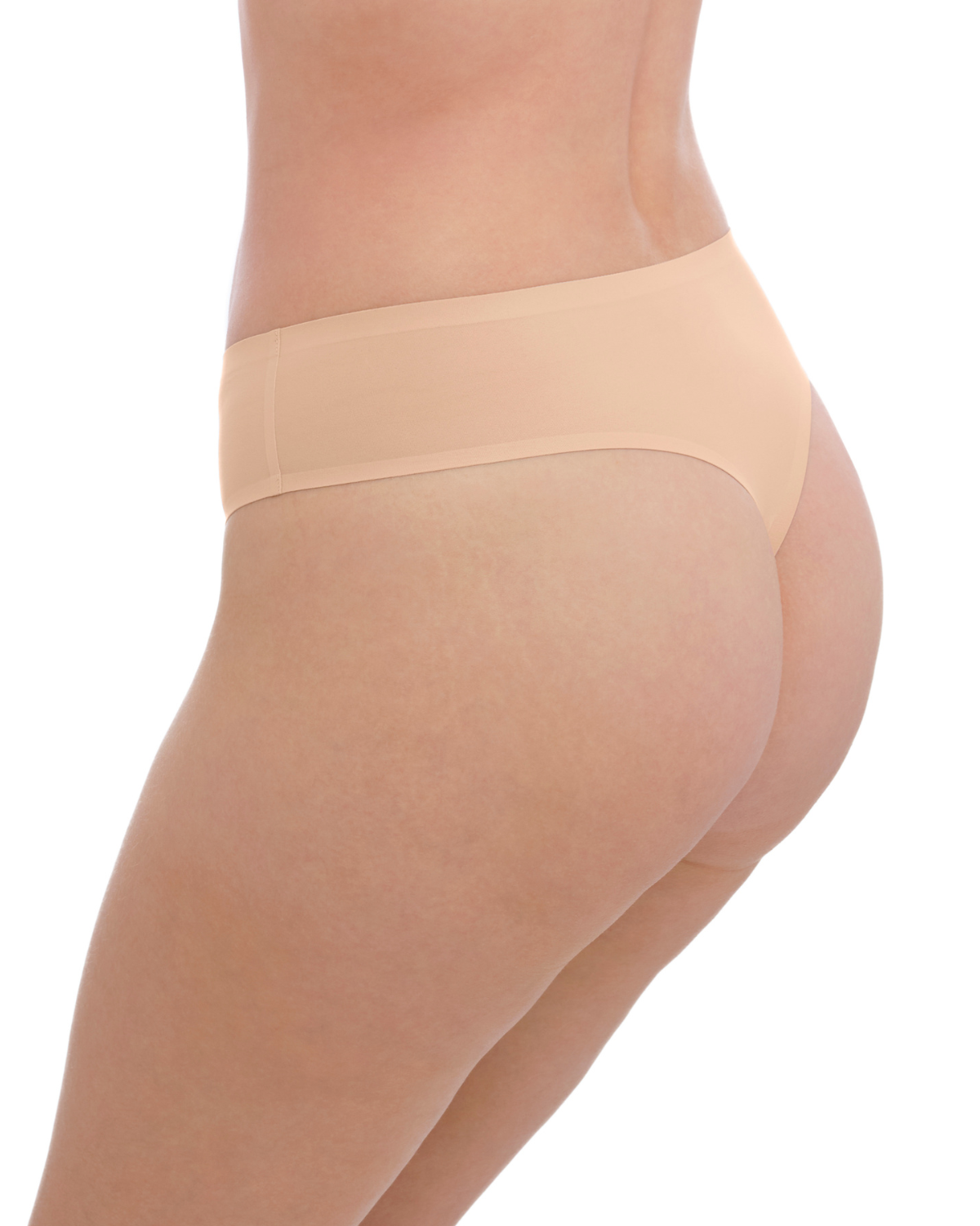 Model wearing a seamless thong in beige/ nude