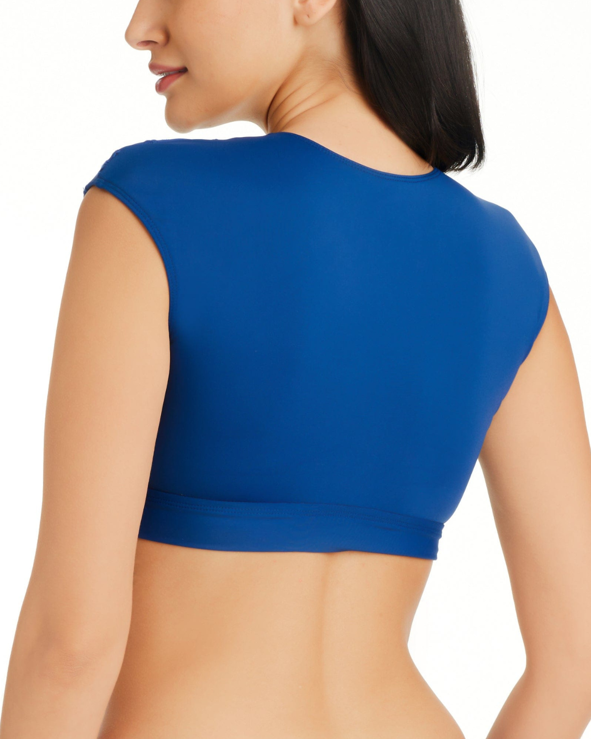 Model wearing a v neck crop top cap sleeve bikini top in navy
