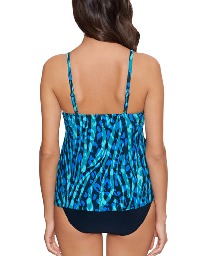 Model wearing a tankini top with adjustable straps in a blue and navy animal print