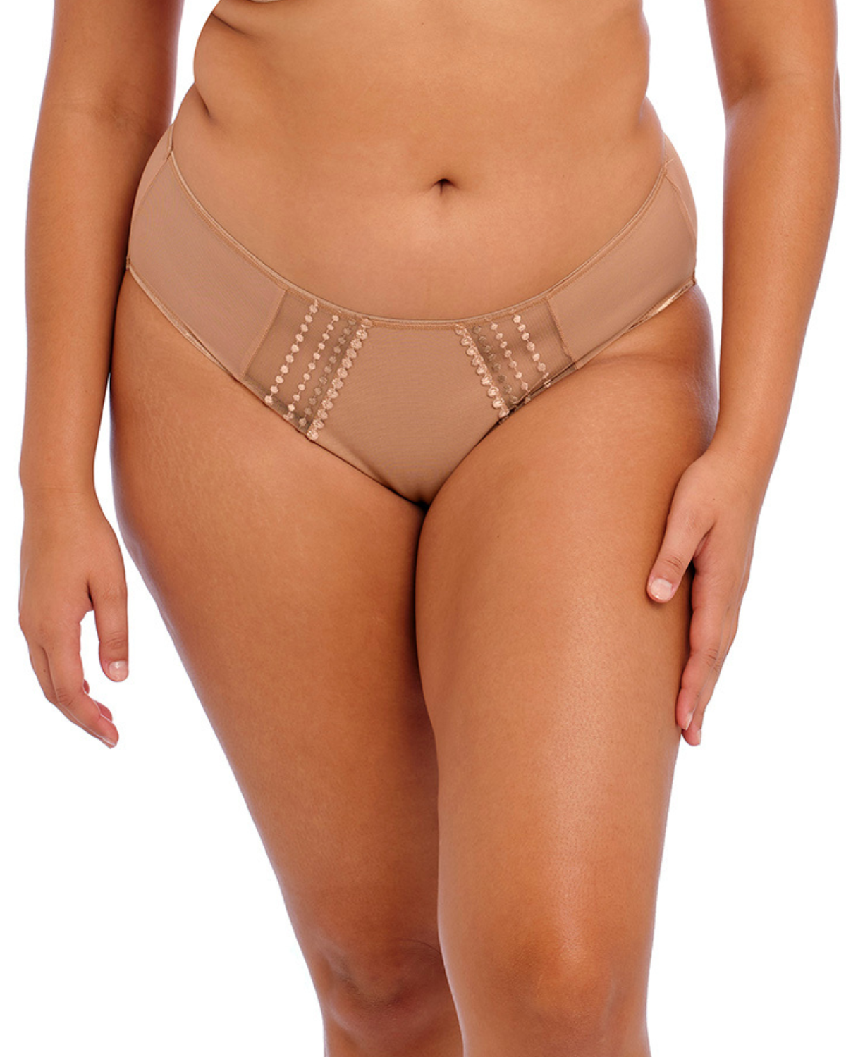 Model wearing a full brief panty with mesh inserts and beaded embroidery in beige/ nude.