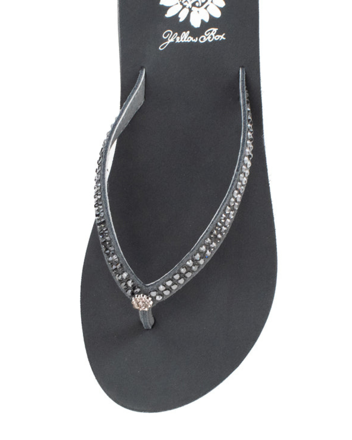 Top view of a grey wedge sandal with rhinestones on the strap on a white backdrop. The sandal has 1.75" heel height and 0.75" platform height.
