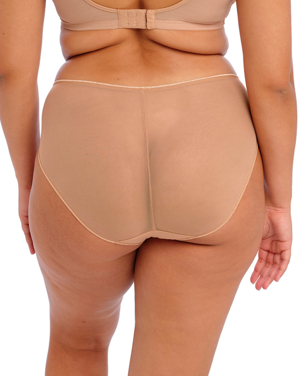 Model wearing a full brief panty with mesh inserts and beaded embroidery in beige/ nude