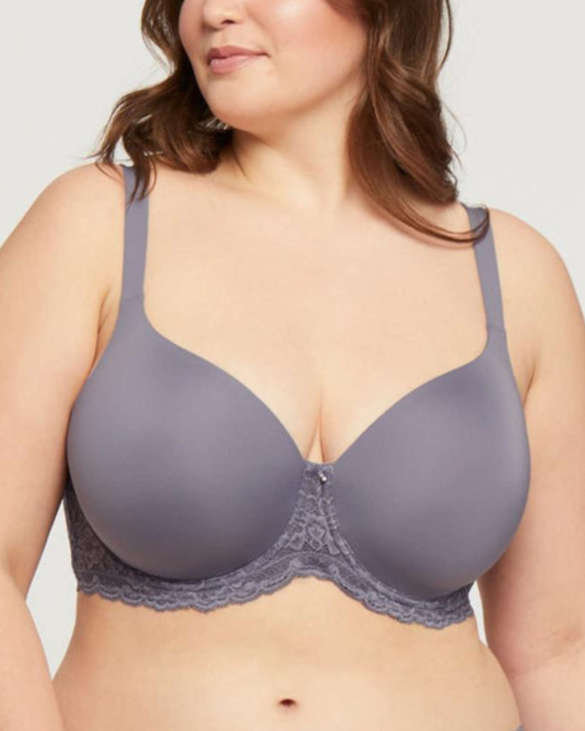 Model wearing a molded t-shirt underwire bra with lace side wings in grey