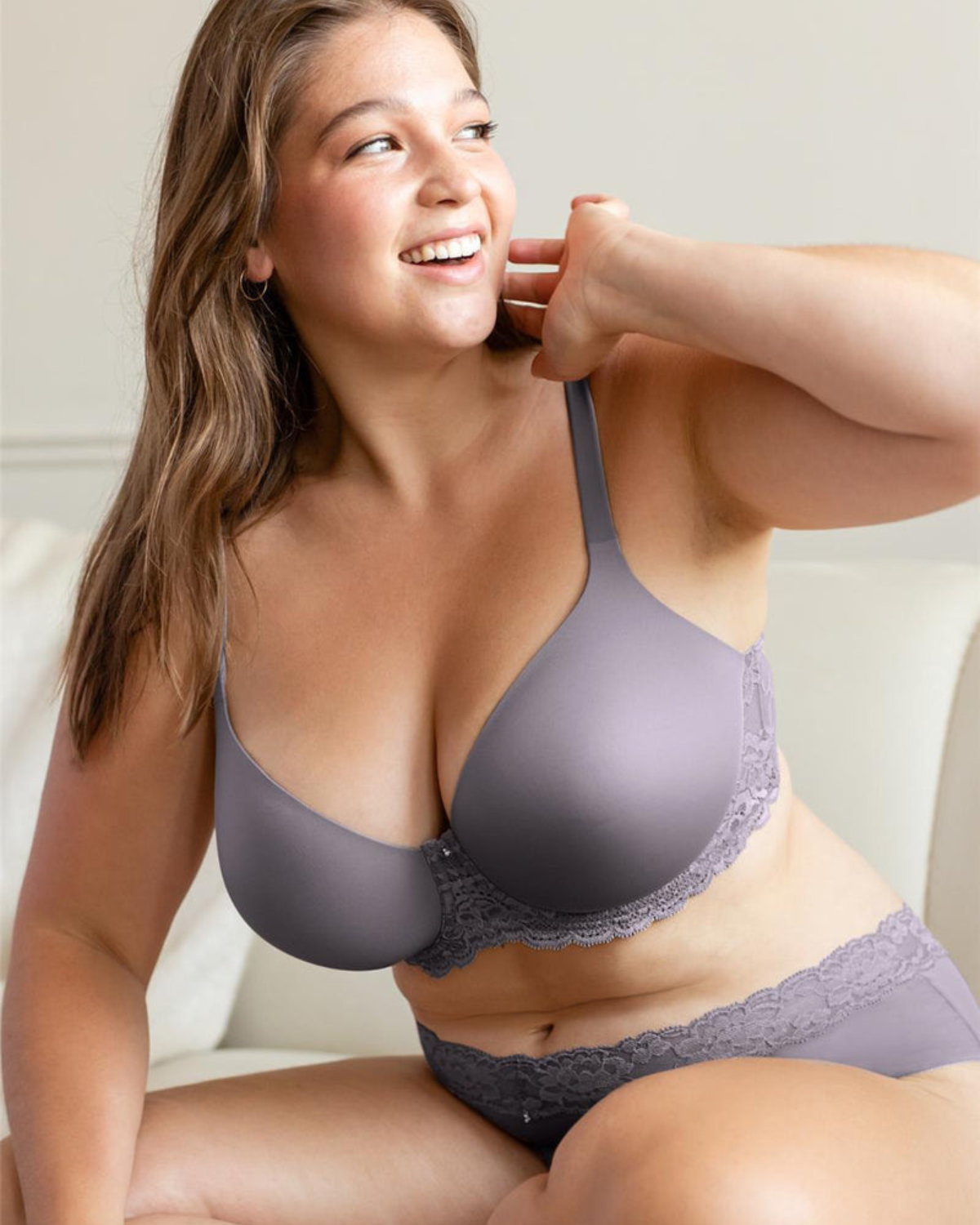 Model wearing a molded t-shirt underwire bra with lace side wings in grey
