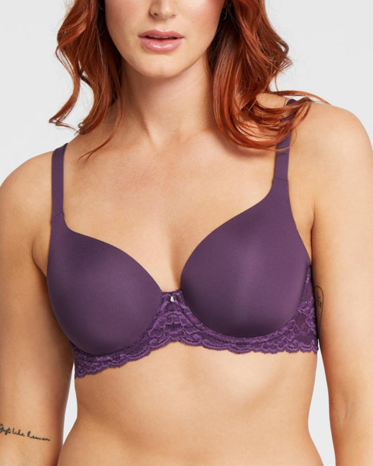 Model wearing a molded t-shirt underwire bra with lace wings in purple