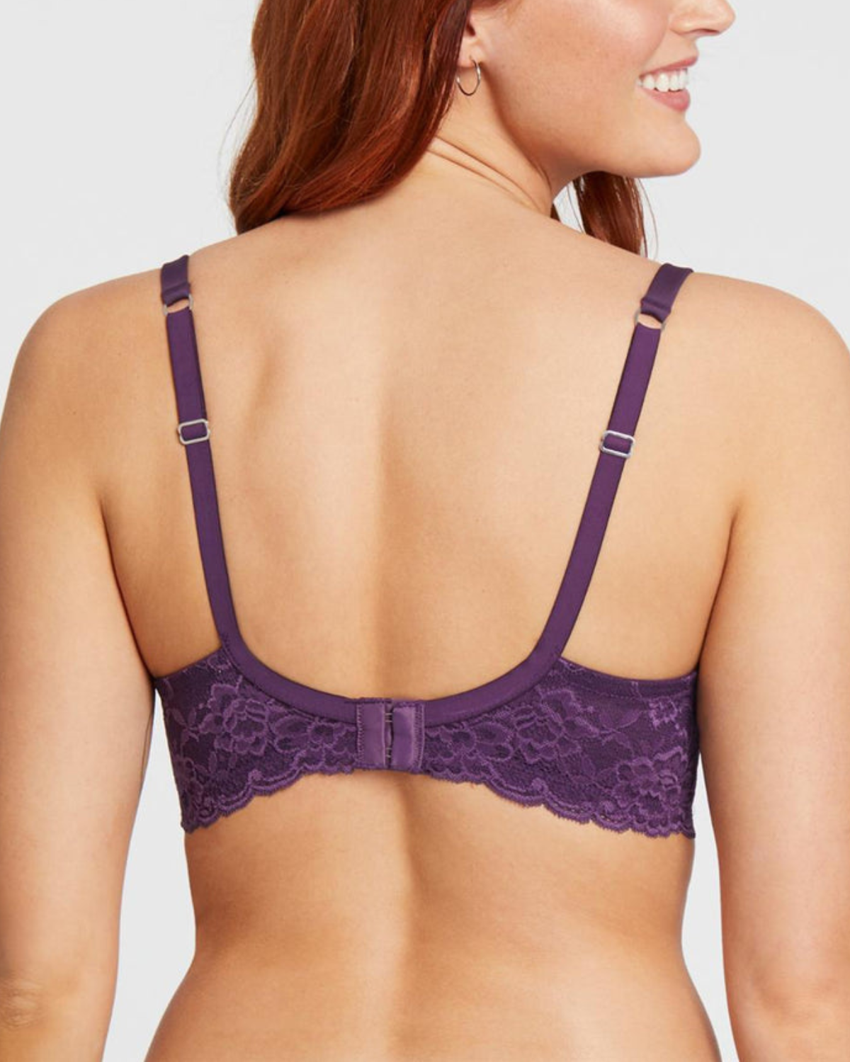 Model wearing a molded t-shirt underwire bra with lace wings in purple