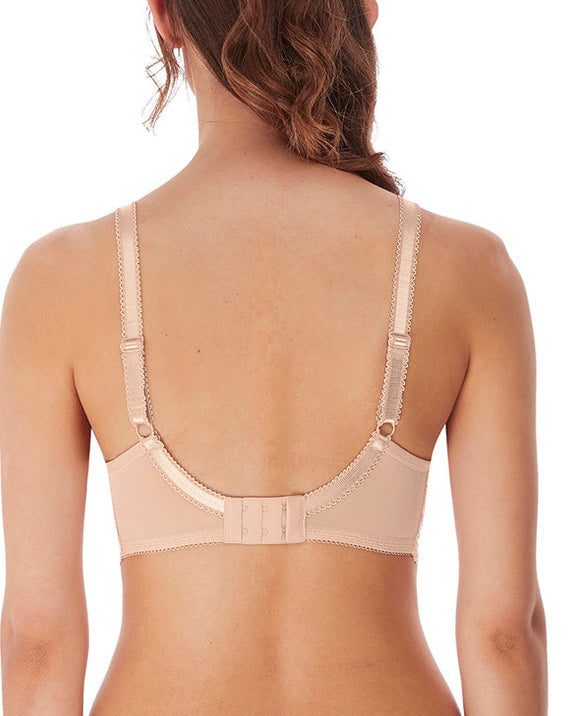 Model wearing a molded plunge underwire bra in beige
