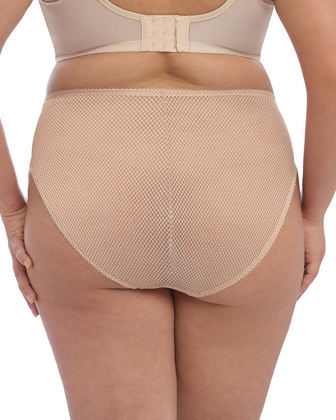Model wearing a hi cut full brief panty in beige/ nude