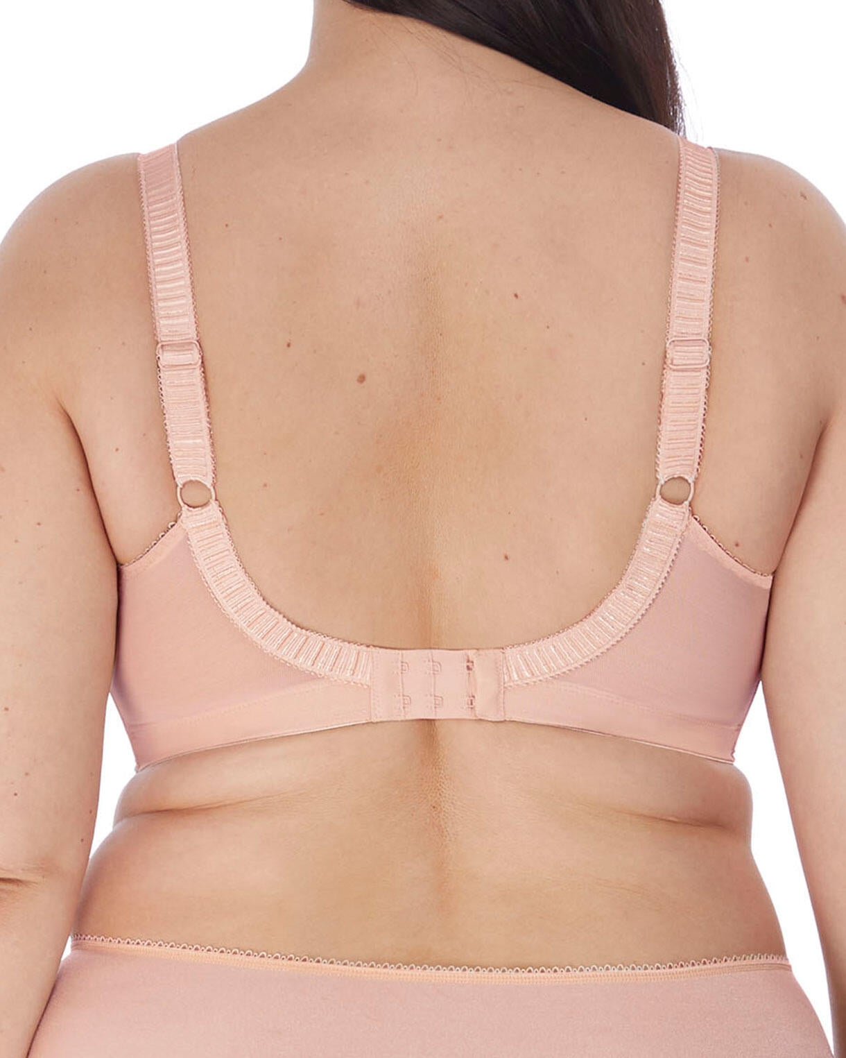 Model wearing a soft cup wire free bra in nude/ beige