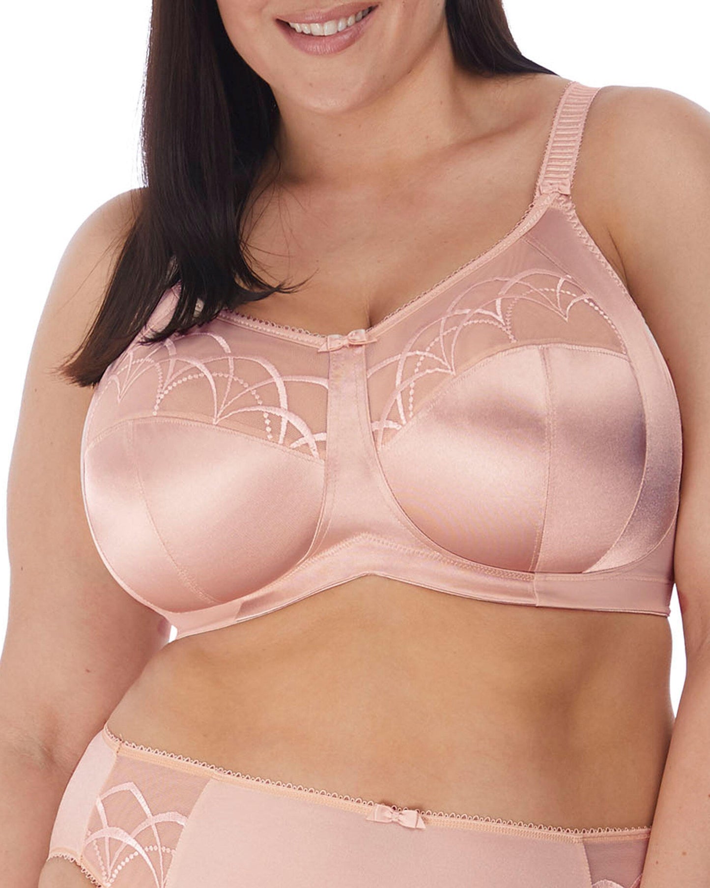 Model wearing a soft cup wire free bra in nude/ beige