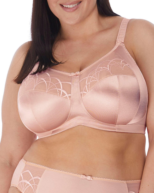 Model wearing a soft cup wire free bra in nude/ beige 