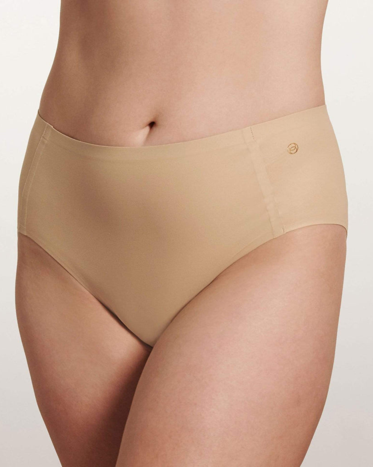 Model wearing a light nude high waist seamless brief panty