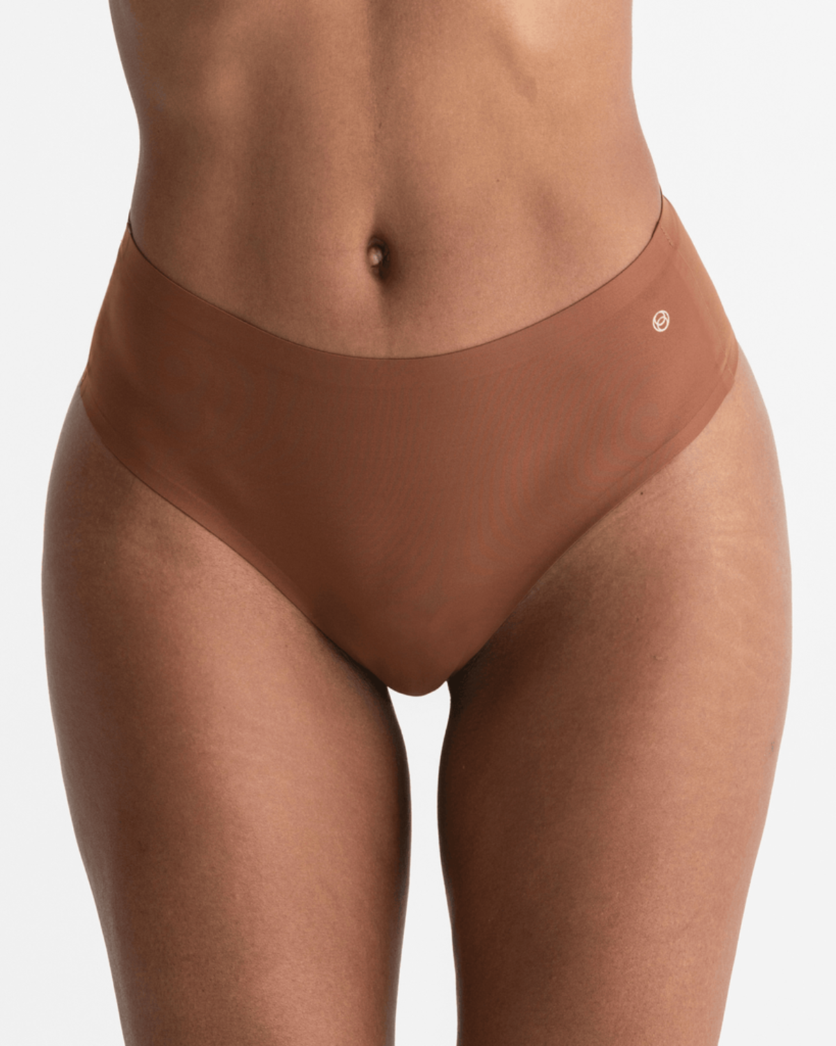 Model wearing a dark nude high waist seamless thong