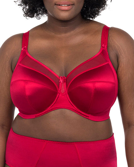 Model wearing a cut and sew underwire banded bra in red