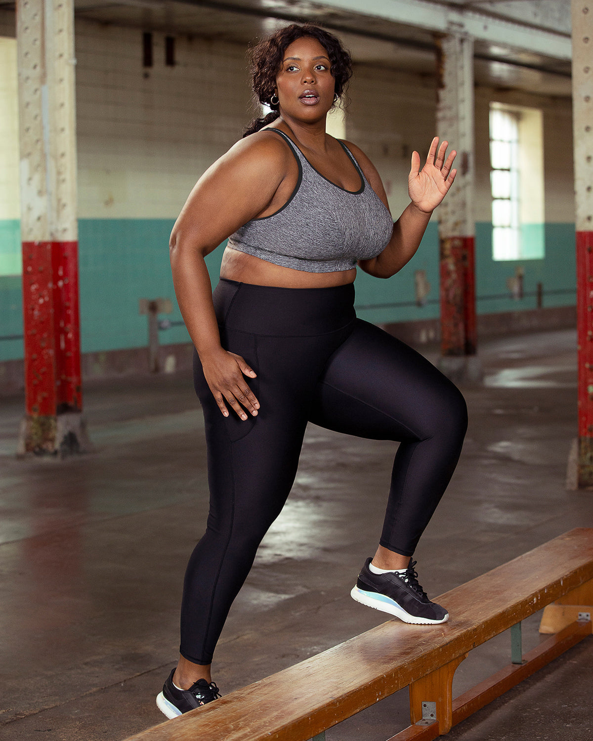 Model working out wearing a wire free sports in grey