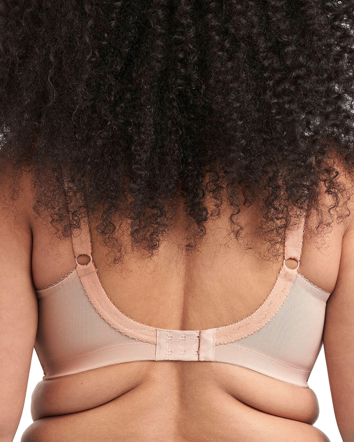 Model wearing a soft cup wire free bra in light beige