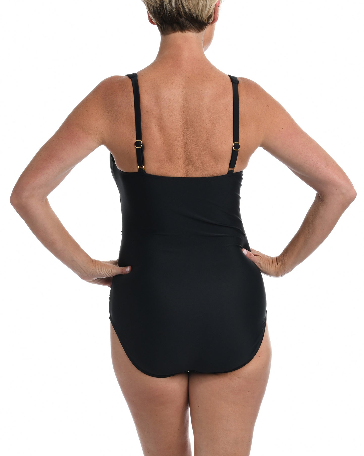 Model wearing a one piece swimsuit with a twist front detail in black