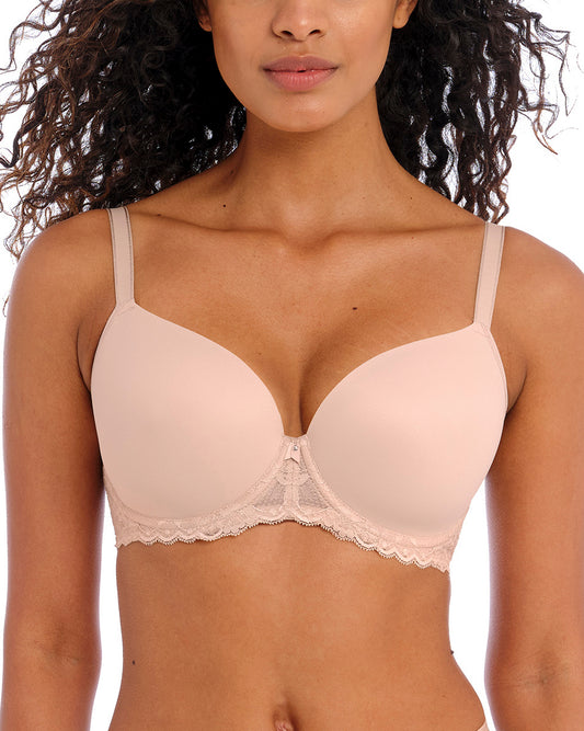 Model wearing an underwire molded demi bra in beige