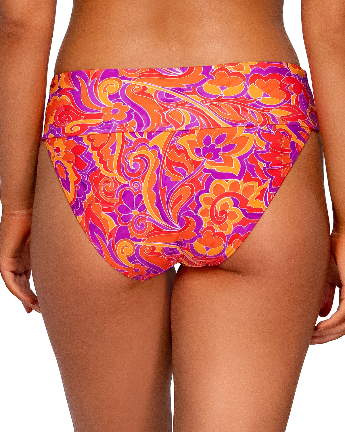 Model wearing a high waist fold over bottom in a purple, red, yellow and orange paisley print.