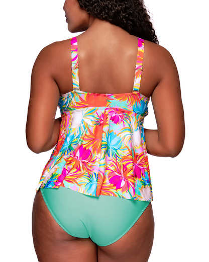 Model wearing a babydoll style tankini with hidden underwire in an orange, turquoise, white and pink floral print.