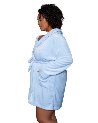 Model wearing a knee length plush robe in light blue