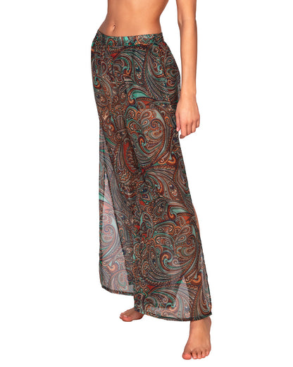 Model wearing a cover up beach pant with side slit in a brown and turquoise paisley print. 