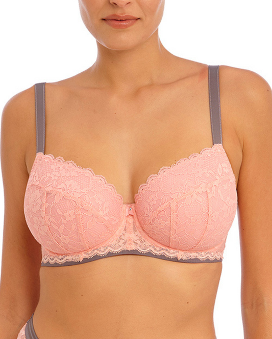 Model wearing a padded half cup underwire bra in pink