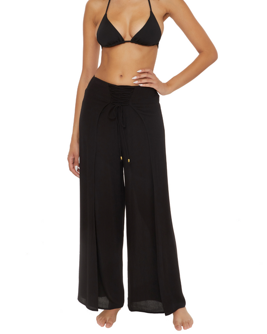 Model wearing wide leg cover up pants in black