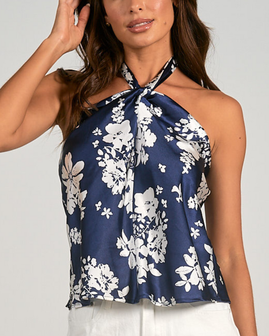 Model wearing a high neck floral navy and white top