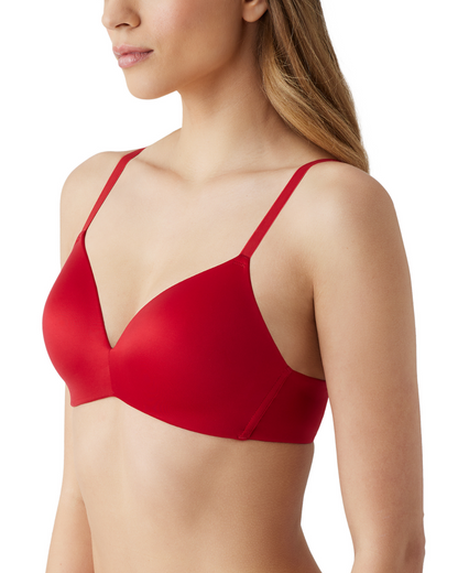 Side view of a model on a white backdrop wearing a red wire-free t-shirt bra with smooth molded cups.