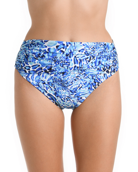 Model wearing a mid waist sash band bottom in a blue and white aquatic print