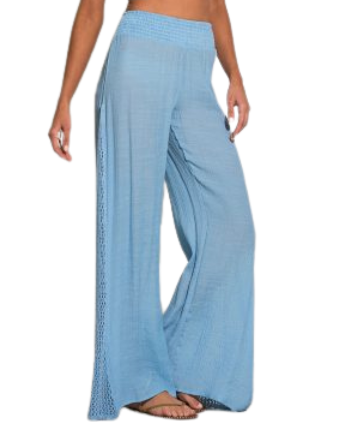 Model wearing a cover up pant with crochet side detail in light blue