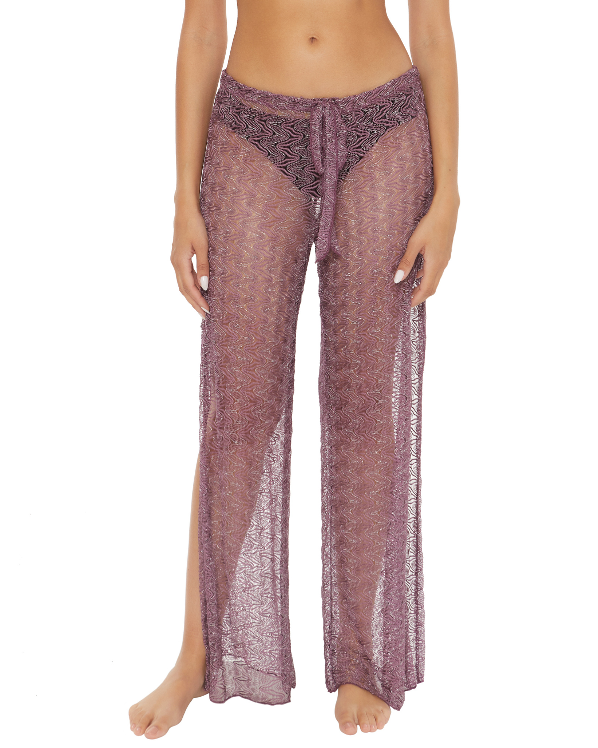 Model wearing a split leg crochet cover up pant in fig