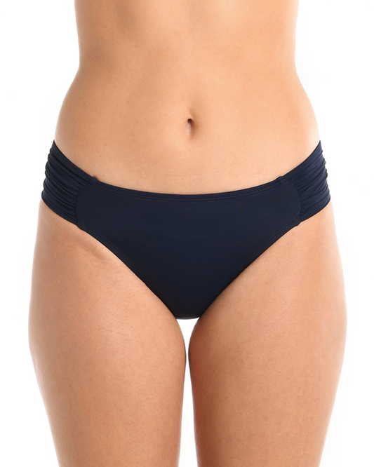 Model wearing a side shirred hipster bikini bottom in indigo