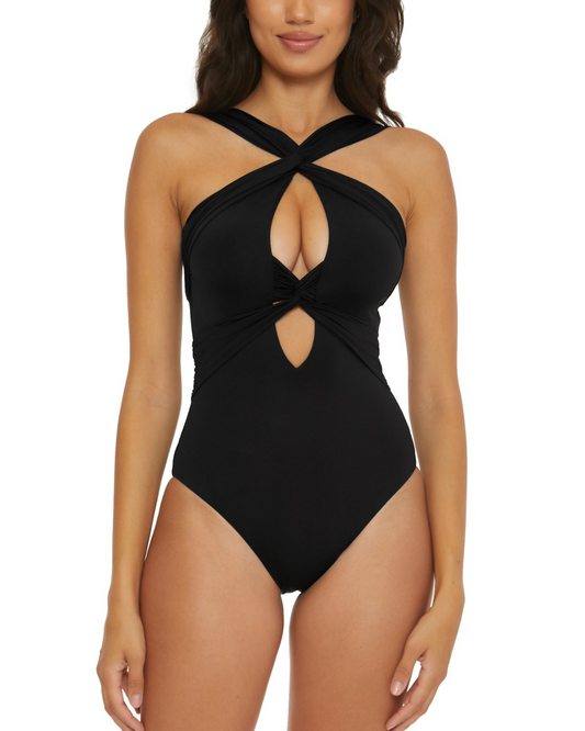 Model wearing a high neck one piece in black