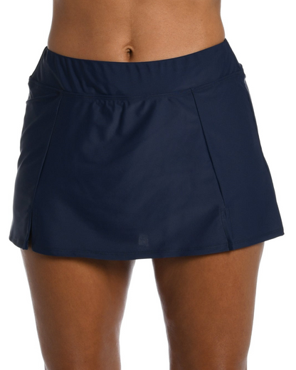 Model wearing a swim skirt with shorts underneath in indigo