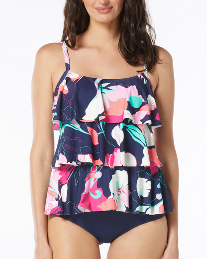 Model wearing a triple tiered tankini top in a navy, white, pink and blue abstract floral print