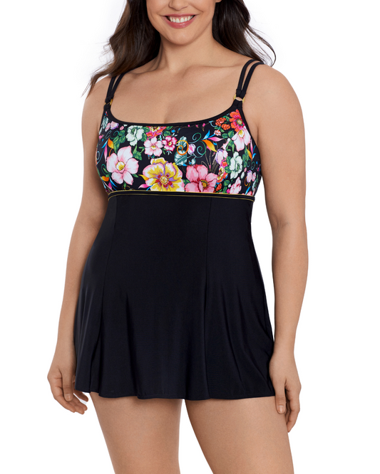 Model wearing an empire seam swimdress with a black base and multi color floral print top half