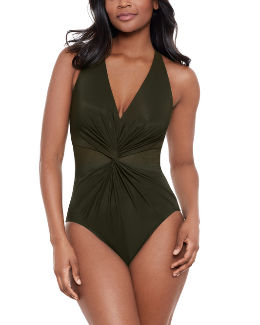 Model wearing a one piece swimsuit with a v neck and twist detail in green