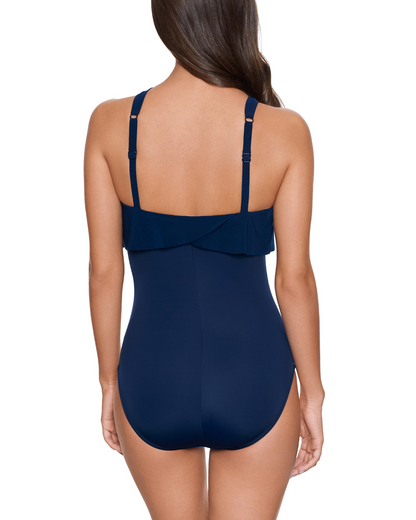 Model wearing a high neck one piece in navy