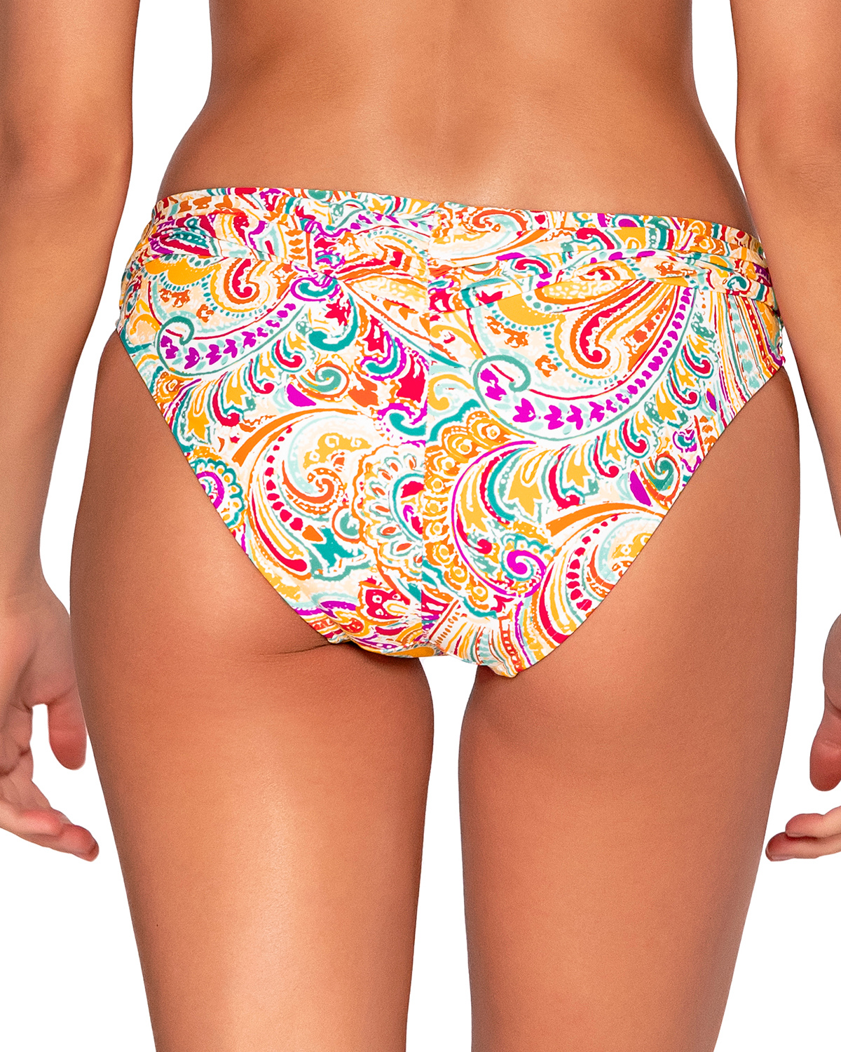 Model wearing a hipster bikini bottom in a white, yellow, red, purple and turquoise paisley print.