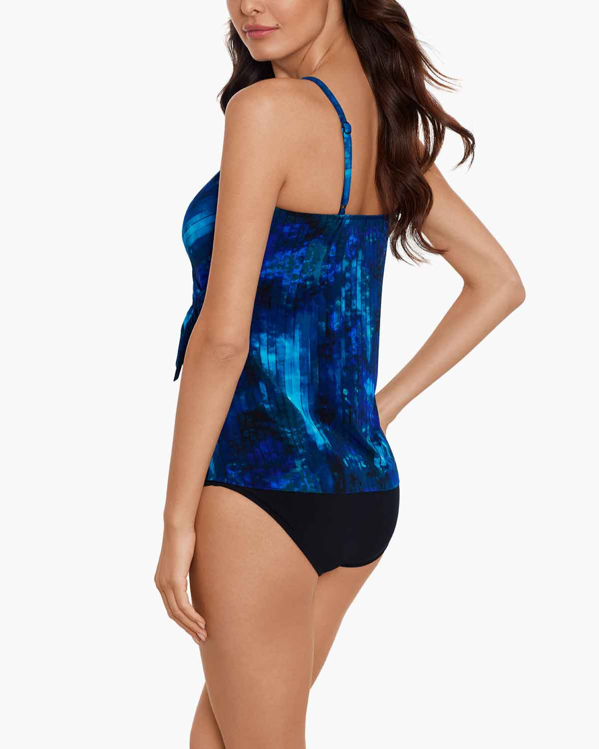 Model wearing a tankini top with adjustable straps in and abstract blue, black and navy 