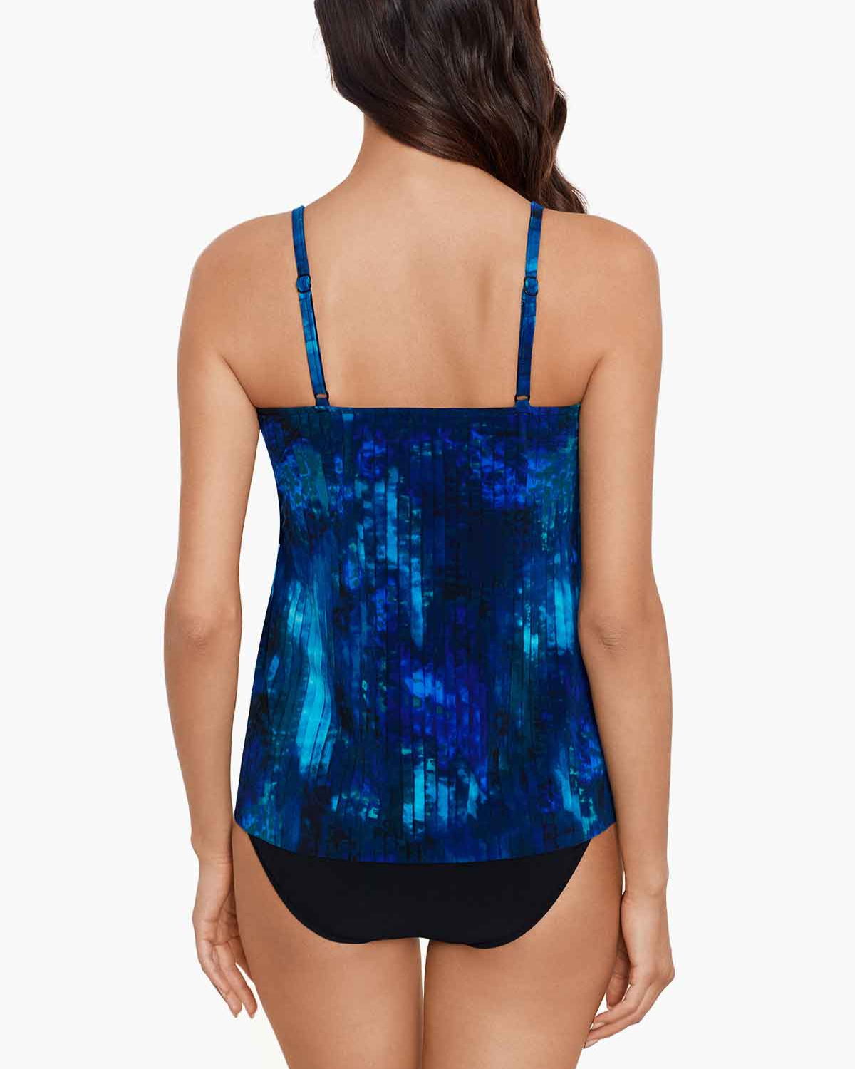 Model wearing a tankini top with adjustable straps in and abstract blue, black and navy 